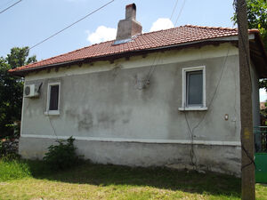 Partially renovated country house with land in big village 