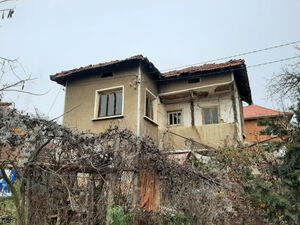 An old house with plot of land & quiet location in village