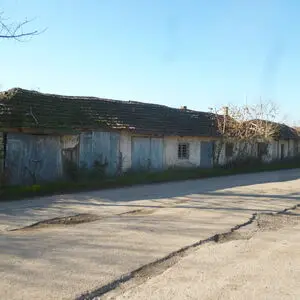 Old warehouse with 6 garages & land 20 km from river harbour