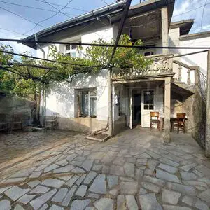 A two-story house with a yard in the village of Granitovo